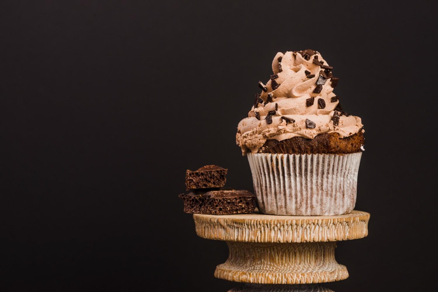 Pipe generous swirls of frosting on each cupcake, and if you want that “death by cupcakes” drama, sprinkle them with chocolate curls or crushed cookies